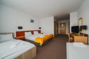 Postel nebo postele na pokoji v ubytování Vila Horec - depandance hotela Hubert Vital Resort + 29 fotografií