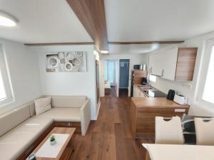 a living room with a couch and a table at HOUSE BOAT OLIVA - Floating House in Pula