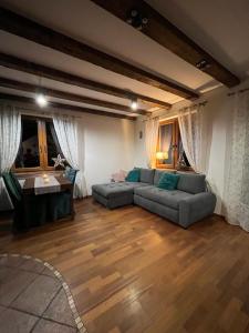 a living room with a couch and a table at Majcia in Jelenia Góra +1 photo