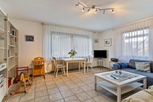 a living room with a couch and a table at Ferienwohnung Frechehof 74qm in Bad Peterstal