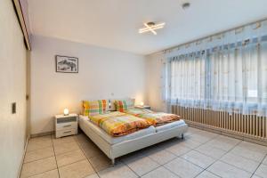 מיטה או מיטות בחדר ב-Ferienwohnung Frechehof 74qm