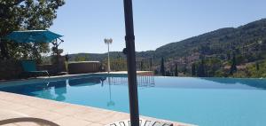 Bazén v ubytování Studio 30 M² avec piscine et vue exceptionnelle nebo v jeho okolí