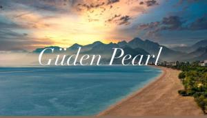 ein Bild eines Strandes mit den Worten "goldene Perle" in der Unterkunft Güden-Pearl in Antalya
