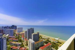 an aerial view of a city with the ocean at Prestigious Sea View Aparthotel In Orbi City Batumi in Batumi