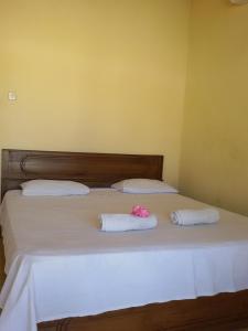 Postel nebo postele na pokoji v ubytování Syifa Homestay