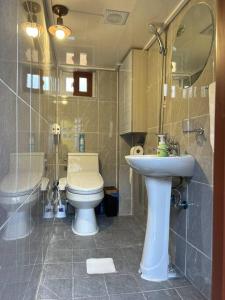 a bathroom with a toilet and a sink at Gilgaon Hanok Stay in Seoul +41 photos