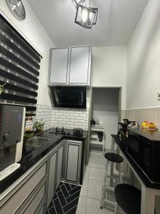 Η κουζίνα ή μικρή κουζίνα στο MK Homestay Perlis