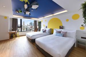 Postel nebo postele na pokoji v ubytování Fullon Poshtel - Kaohsiung + 37 fotografií