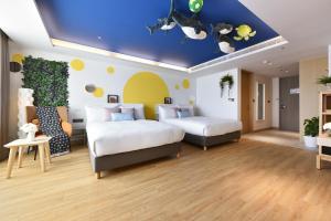 Ліжко або ліжка в номері Fullon Poshtel - Kaohsiung