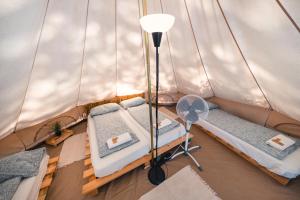 an overhead view of a tent with beds and a fan at Pigna Felice Punta Ala in Punta Ala