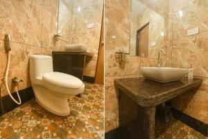 uma casa de banho com um WC e um lavatório em FabExpress MA Homes em Morjim