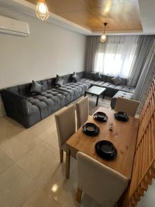 a living room with a couch and a table at Holikeys - El jadida - 2 Ch - Sidi bouzid 005 in El Jadida