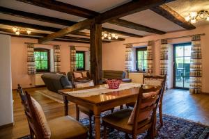 a dining room with a table and chairs at Ferienhaus Schmiedehof in Hitzing