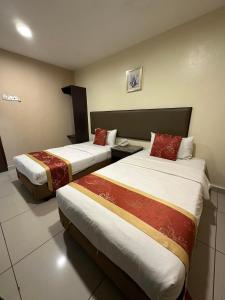 Postel nebo postele na pokoji v ubytování SohoTown Hotel