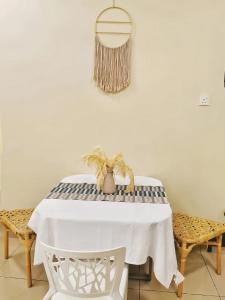 a white table with a black and white table cloth at The Majestic Ipoh in Ipoh