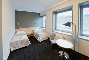 a hospital room with two beds and a table at Pokoje Gościnne Stara Kopalnia in Wałbrzych +15 photos
