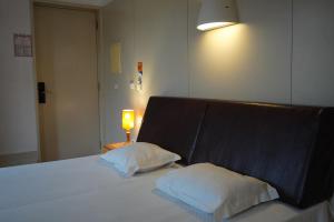 Cama ou camas em um quarto em HI Guimaraes - Pousada de Juventude