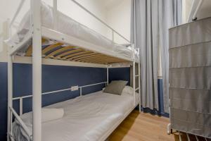 a couple of bunk beds in a room at Central Apt 7px a 50 metros de Retiro-Museo del Prado in Madrid