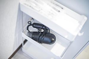 a hair dryer in a drawer in a room at Fukugenkaku - Vacation STAY 14218 in Osaka