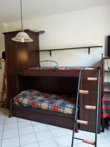 a bunk bed in a room with a bunk bed at Monolocale Abetone Cutigliano in Pian di Novello