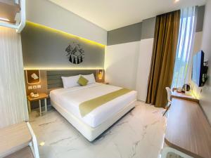Krevet ili kreveti u jedinici u okviru objekta Facade Hotel by Azana