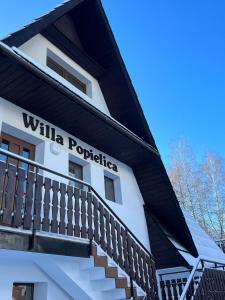 a building with the words willka portugal on it at Willa Popielica in Zakopane