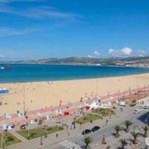 a view of a beach and the ocean at Appart Hotels Wouroud in Tangier