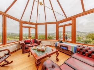 a living room with a large glass ceiling at 3 Bed in Corwen 90459 in Corwen