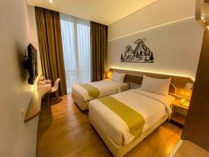Krevet ili kreveti u jedinici u okviru objekta Facade Hotel by Azana