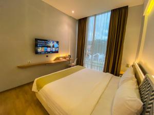 Krevet ili kreveti u jedinici u okviru objekta Facade Hotel by Azana
