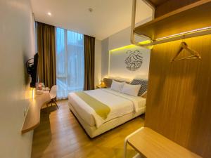Krevet ili kreveti u jedinici u okviru objekta Facade Hotel by Azana