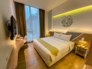 Voodi või voodid majutusasutuse Facade Hotel by Azana toas +37 fotot