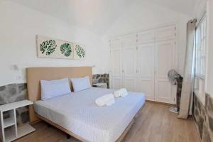 Ένα ή περισσότερα κρεβάτια σε δωμάτιο στο Costa Gaviotas Bungalow