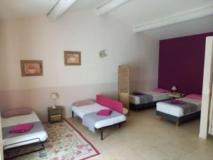 Postel nebo postele na pokoji v ubytování Le Mas de l'Escaillon