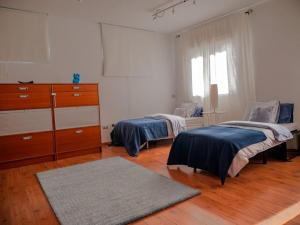 Кровать или кровати в номере Sarabanda