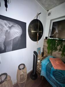 a room with a wall with a picture of an elephant at La bulle à bonheur - Spa privatif 