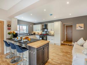 an open kitchen and living room with a large island at 7 Bed in Bridlington 90787 in Bridlington
