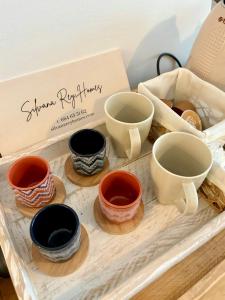 a group of bowls sitting on a wooden tray at Portamar estudio 312 in Almuñécar