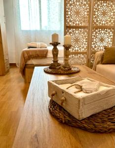 a living room with a table with a box on it at Portamar estudio 312 in Almuñécar