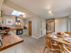 a kitchen with a table and chairs in a room at 2 Bed in County Durham 90576 in Whittonstall +11 photos