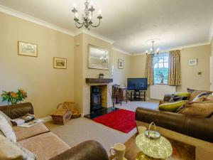 a living room with a couch and a fireplace at 3 Bed in Richmond 90578 in Catterick Bridge