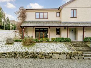 a house with a stone path in front of it at 1 Bed in Ambleside 90636 in Ambleside