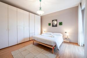 Postel nebo postele na pokoji v ubytování Homiday - Pisa - Elegant Apartment- 3 camere 2 bagni