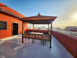a gazebo on the roof of a building at F3 Appartement Point E Dakar in Dakar