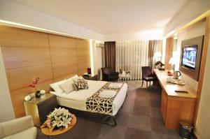 a hotel room with a bed and a desk at Silivri Park Hotel in Silivri