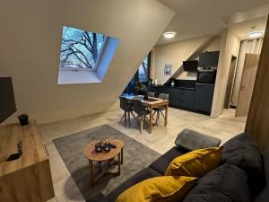 a living room with a couch and a table at Ferienwohnungen Hamminkeln, Berg4Home in Hamminkeln