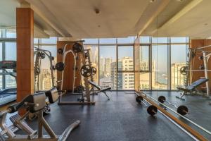 a gym with cardio equipment and a view of the city at Lavish Living in Dubai Marina's Finest 2 bedroom in Dubai