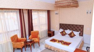 Postel nebo postele na pokoji v ubytování Easy Hotel Kenya + 37 fotografií