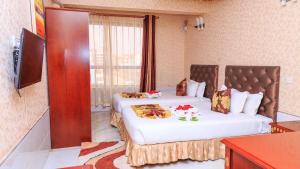 TV a/nebo společenská místnost v ubytování Easy Hotel Kenya