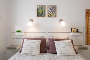 Un pat sau paturi într-o cameră la Sandra Amadores